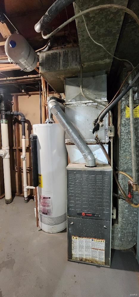 utility room featuring gas water heater