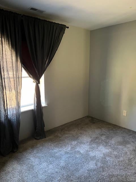 spare room featuring carpet