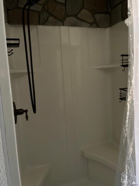 bathroom featuring a shower with curtain