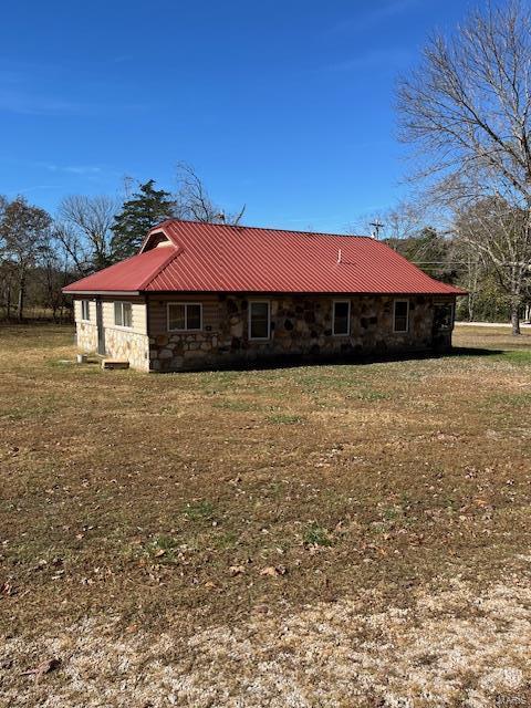 view of property exterior featuring a yard