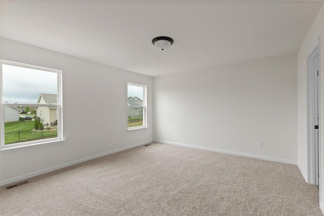 unfurnished room with carpet flooring