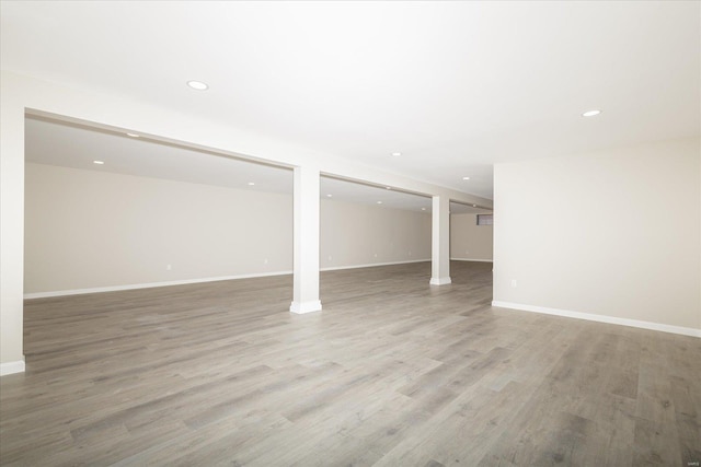 basement with light hardwood / wood-style floors