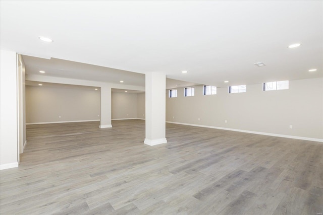 basement featuring light hardwood / wood-style floors