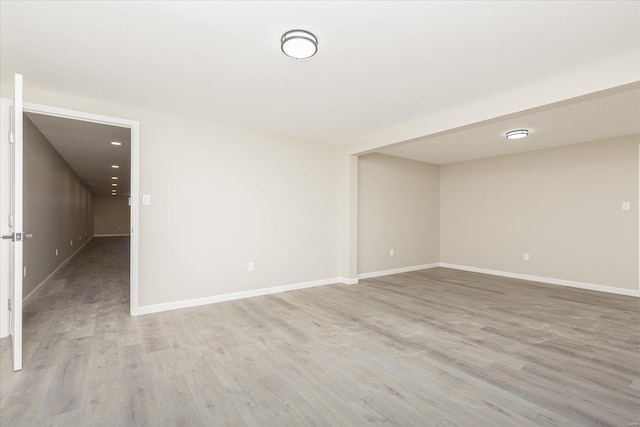 spare room featuring light hardwood / wood-style floors