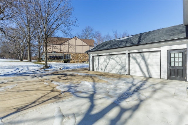 view of snow covered garage