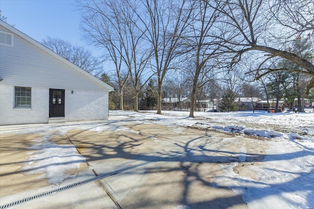 view of yard layered in snow