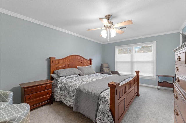 carpeted bedroom with ceiling fan and crown molding