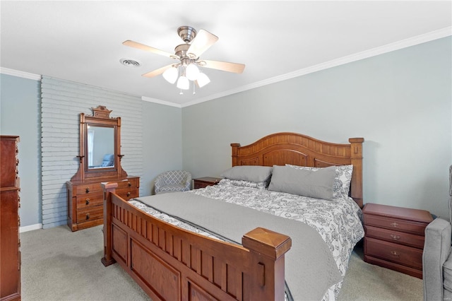 carpeted bedroom with ceiling fan and ornamental molding