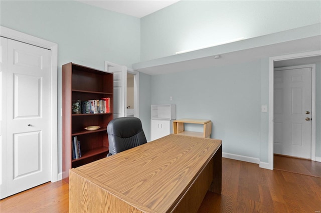 office space with wood-type flooring