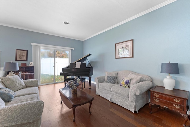 living room featuring hardwood / wood-style floors and crown molding