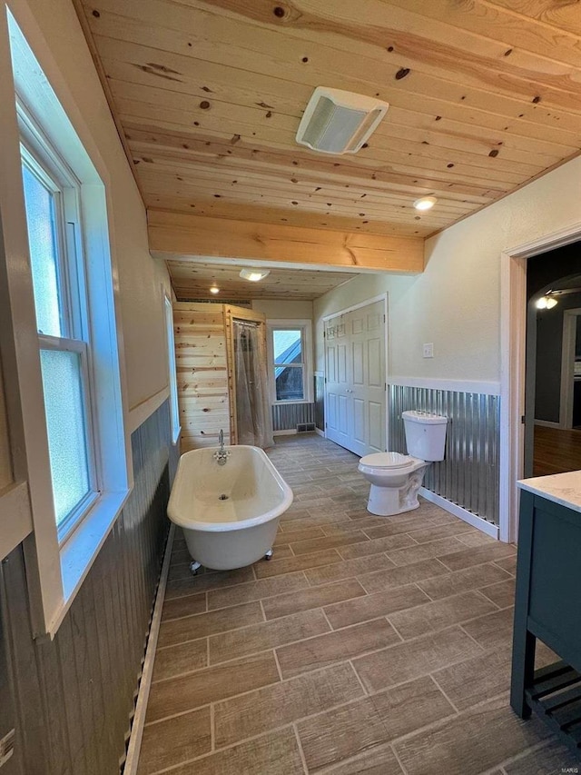 full bathroom featuring hardwood / wood-style floors, wooden ceiling, wood walls, and toilet