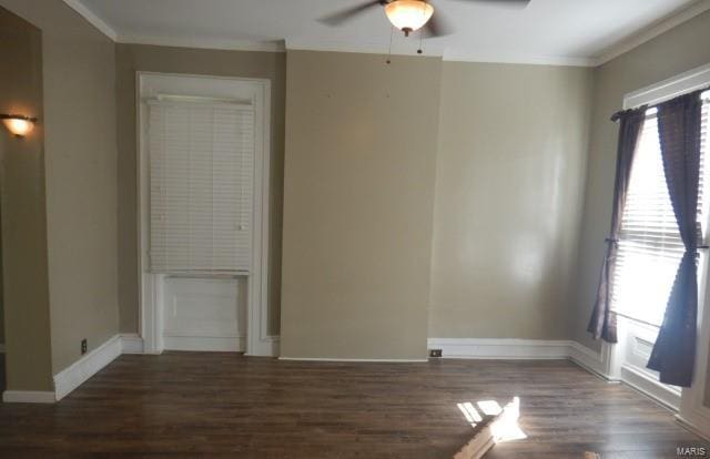 unfurnished room featuring dark wood-type flooring, ornamental molding, and ceiling fan