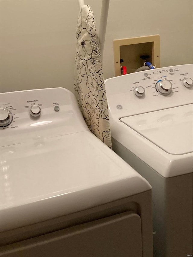 washroom with washer / dryer