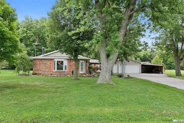 ranch-style house featuring a garage and a front yard