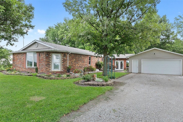 ranch-style house featuring a garage and a front yard