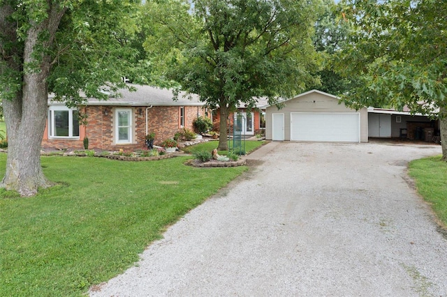 single story home with a front yard and a garage