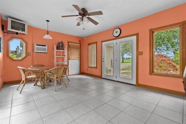 unfurnished dining area featuring a wall unit AC, light tile patterned floors, and ceiling fan