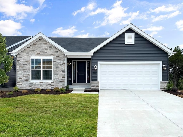 view of front facade with a front yard and a garage