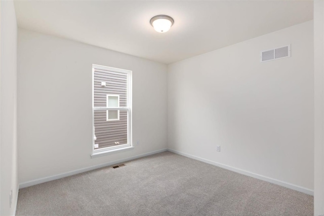 spare room with light carpet