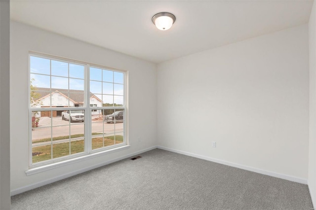 unfurnished room featuring carpet flooring