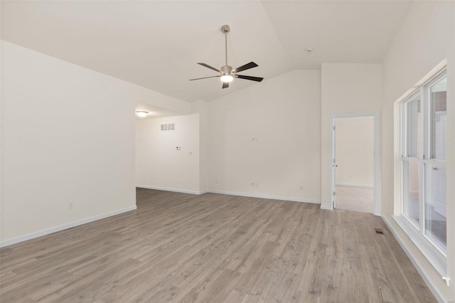 unfurnished room with light wood-type flooring, vaulted ceiling, and ceiling fan