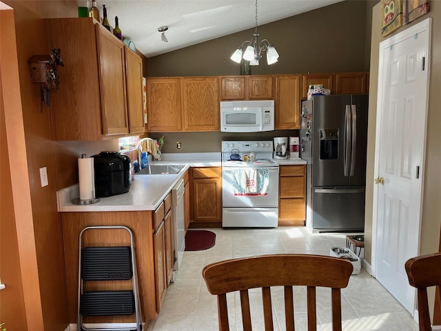 kitchen featuring vaulted ceiling, a chandelier, light tile patterned floors, pendant lighting, and white appliances