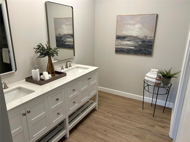 bathroom featuring hardwood / wood-style floors and vanity