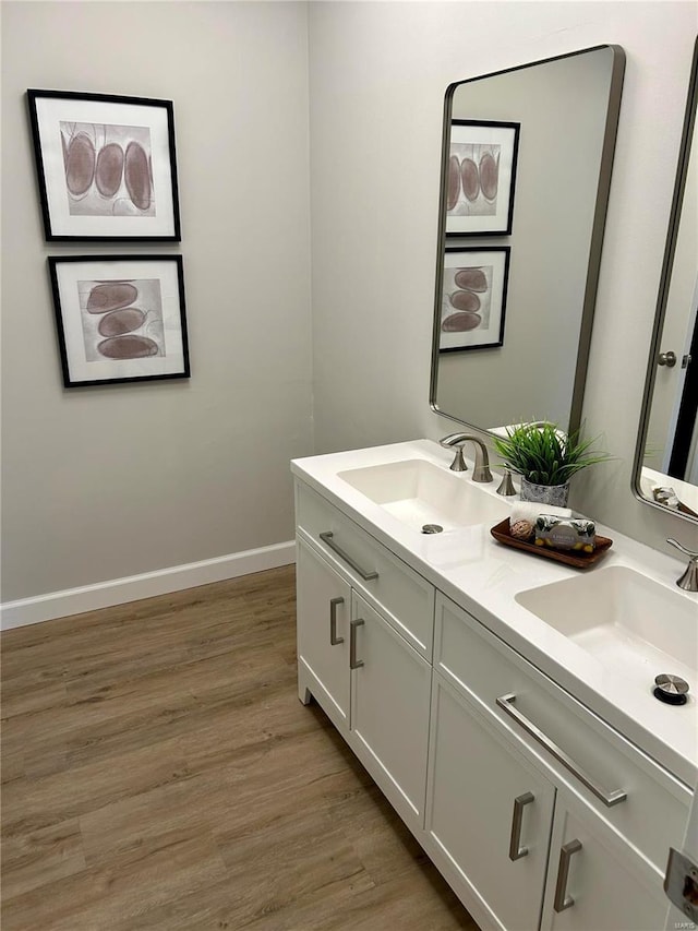 bathroom featuring hardwood / wood-style floors and vanity