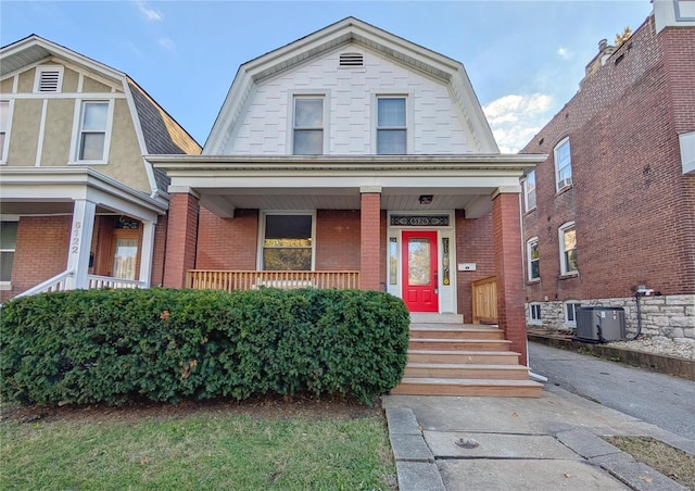 view of front of home featuring a porch and central AC