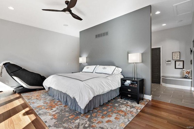 bedroom featuring ceiling fan and dark hardwood / wood-style flooring