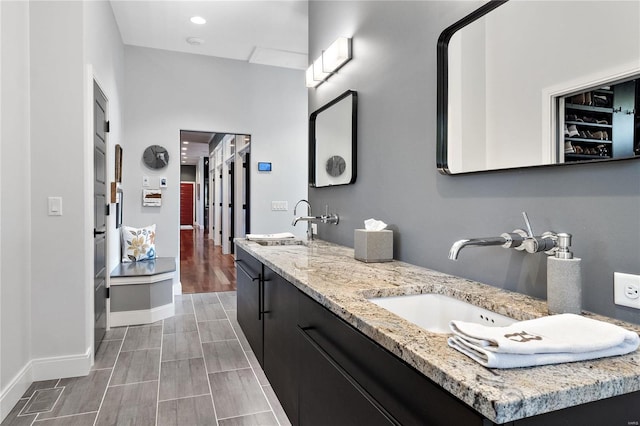 bathroom with vanity and hardwood / wood-style flooring