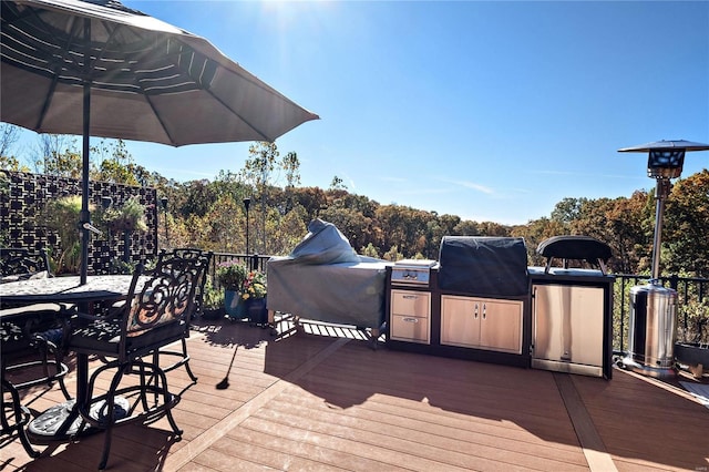 wooden terrace with area for grilling