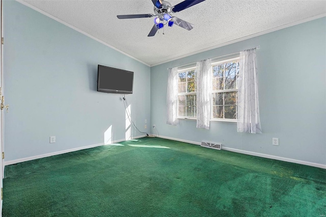 spare room with ornamental molding, a textured ceiling, ceiling fan, carpet floors, and lofted ceiling