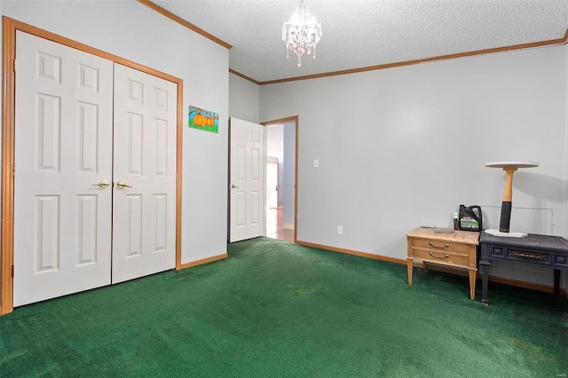 interior space with crown molding, dark carpet, a textured ceiling, and a notable chandelier