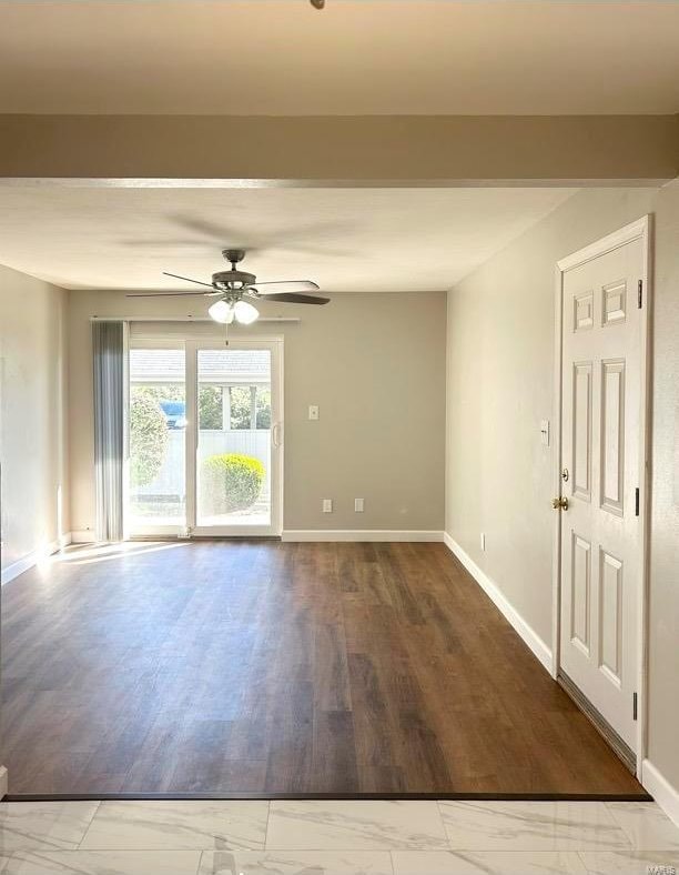 empty room featuring ceiling fan