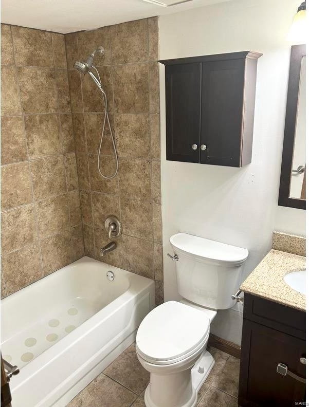 full bathroom featuring vanity, toilet, and tiled shower / bath combo