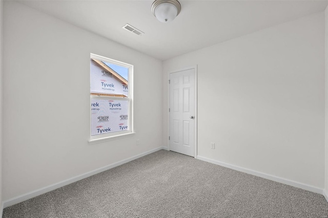 spare room with carpet floors