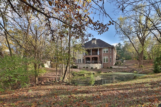 back of property with a balcony