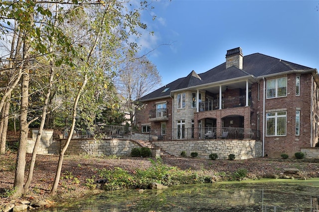 rear view of house with a balcony