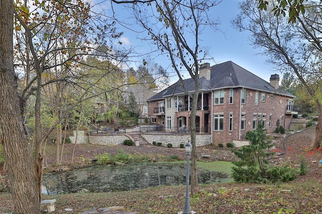 rear view of house with a balcony