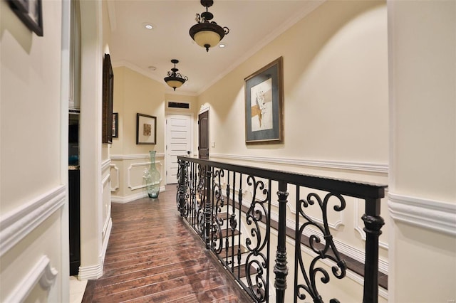 hall with dark hardwood / wood-style flooring and ornamental molding