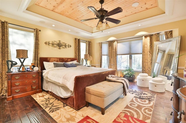 bedroom with hardwood / wood-style floors, a raised ceiling, ceiling fan, and wooden ceiling