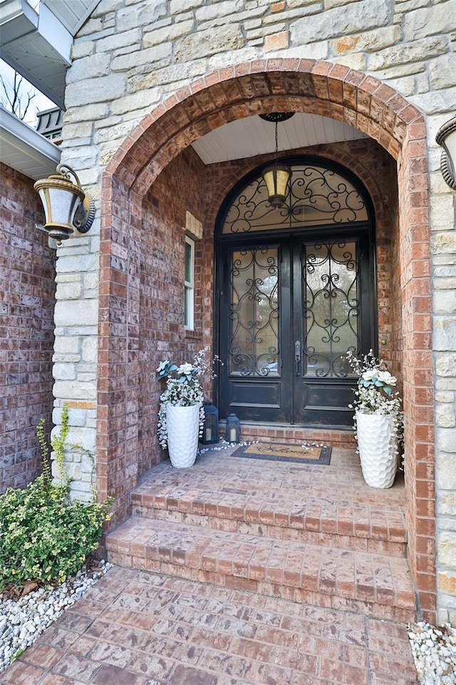 entrance to property featuring french doors