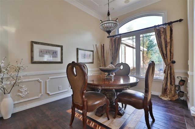 dining room featuring a wealth of natural light, dark hardwood / wood-style flooring, and crown molding