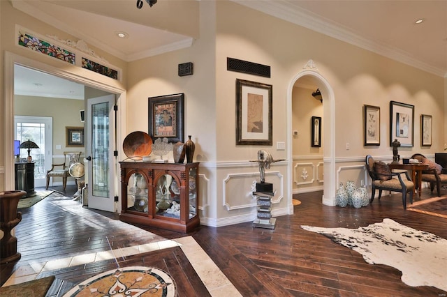 interior space featuring dark hardwood / wood-style flooring and ornamental molding