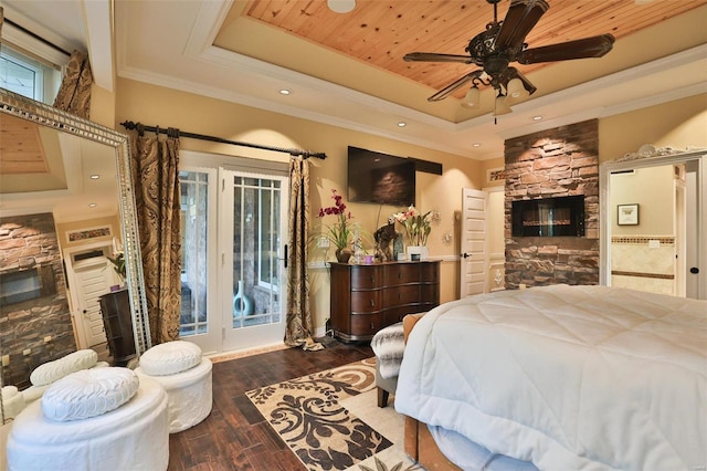 bedroom with ceiling fan, dark hardwood / wood-style floors, a raised ceiling, and wooden ceiling