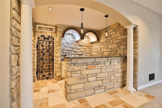 wine room with decorative columns