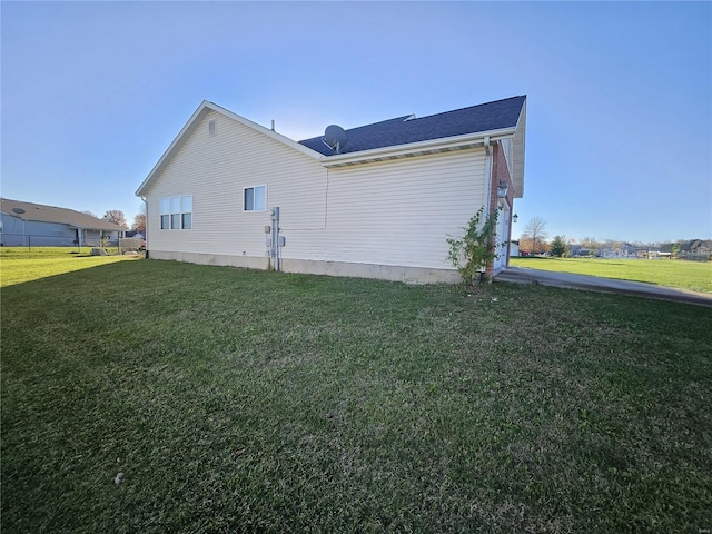 view of home's exterior featuring a lawn