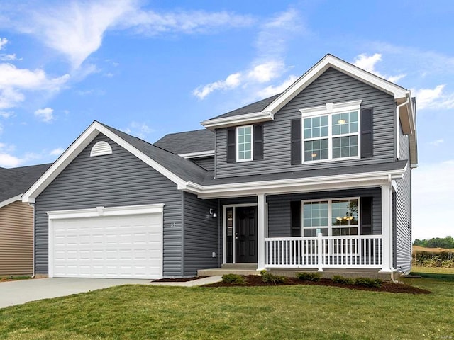 view of property featuring a garage, a front yard, and a porch