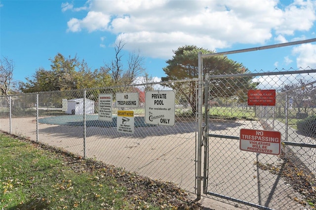 exterior space with fence and a gate